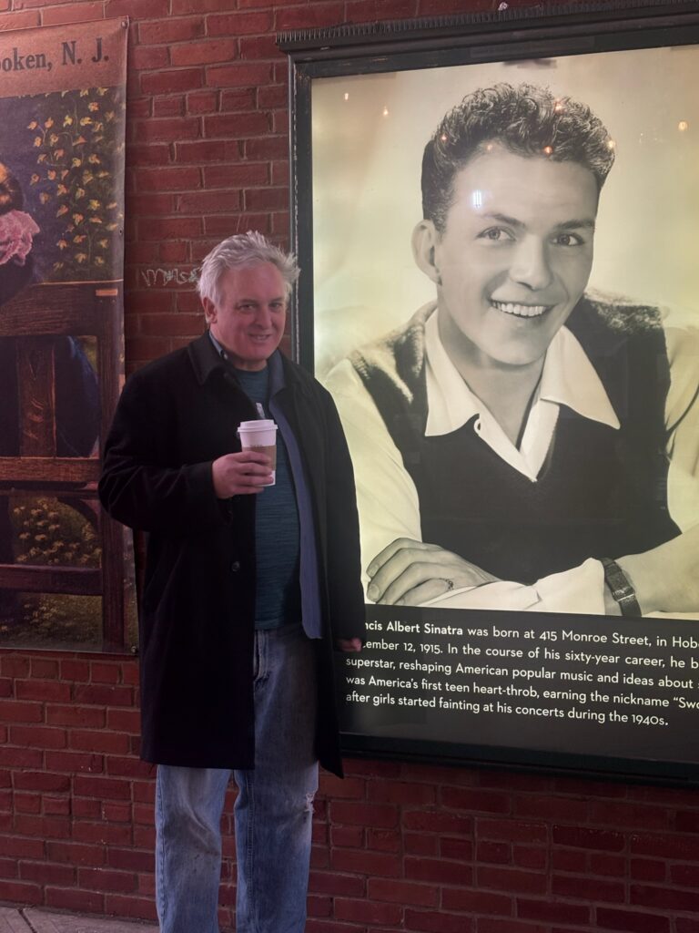 Paul Arata Photo In Front Of Frank Sinatra at Hoboken Historical Museum